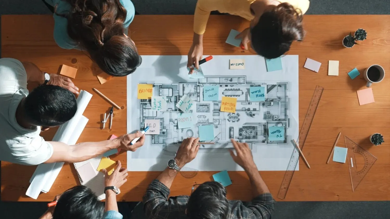 A team reviewing building plans together