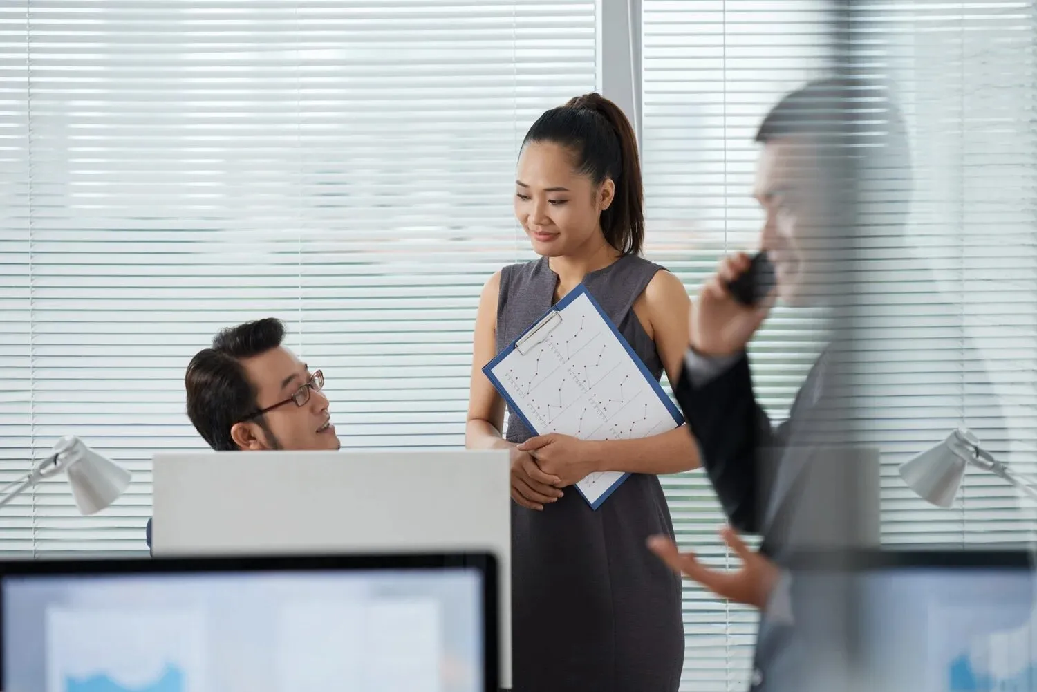 Colleagues collaborating in an open office