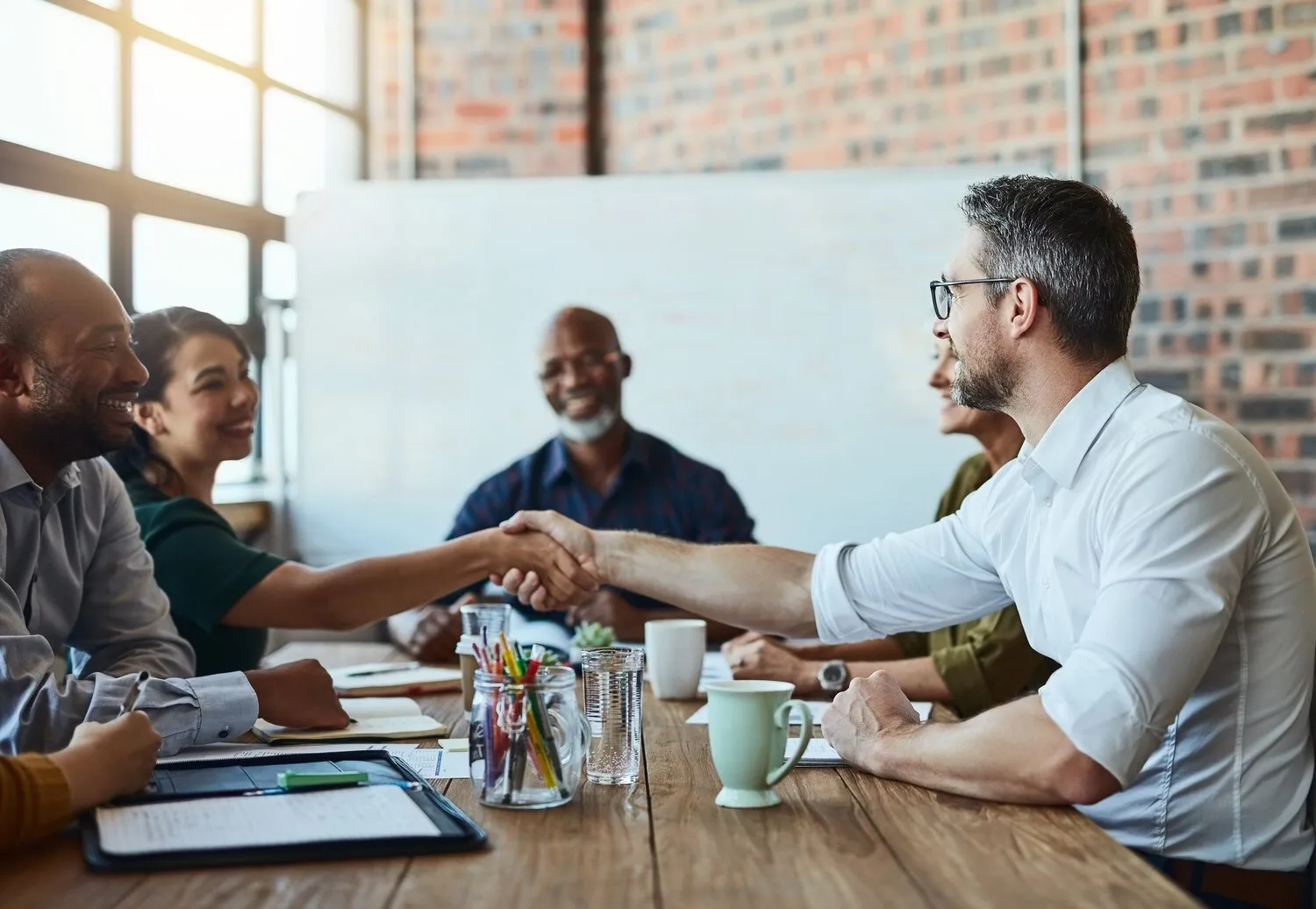 Team meeting with partners around a table